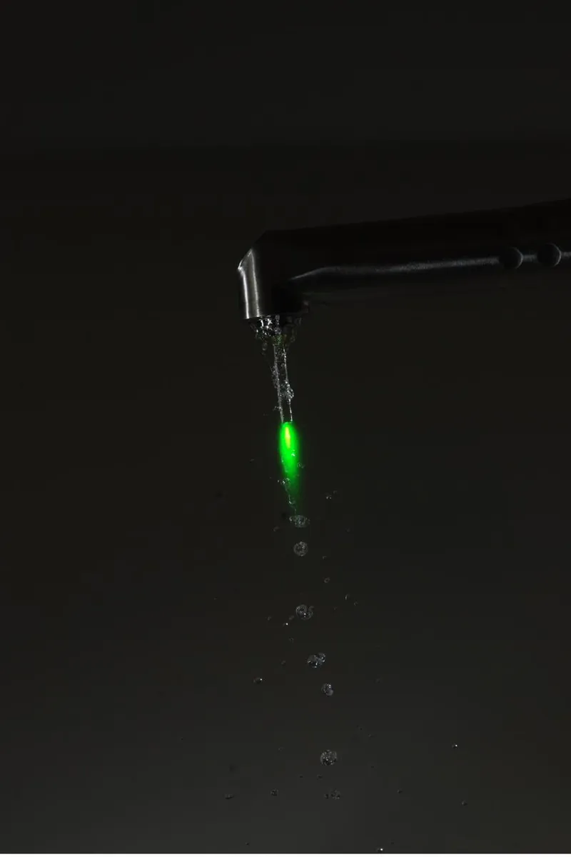 The Fotona dental laser in use, showing its precise targeting beam