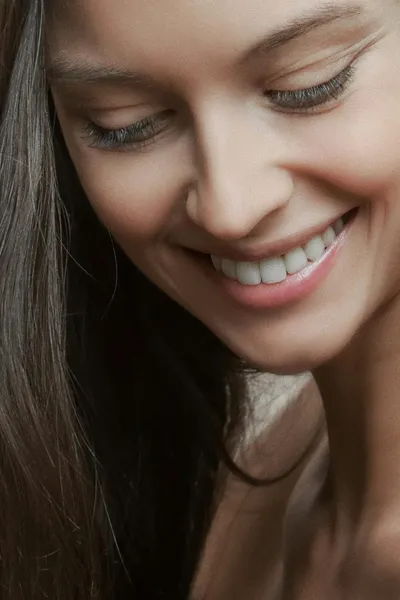 Patient smile portrait — natural light, soft warmth