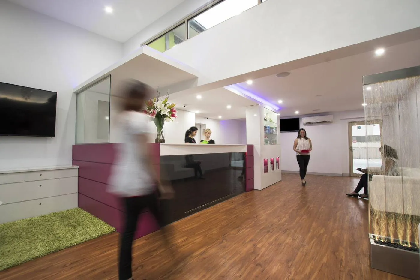 A calm, modern Magical Smiles dental reception area with soft seating