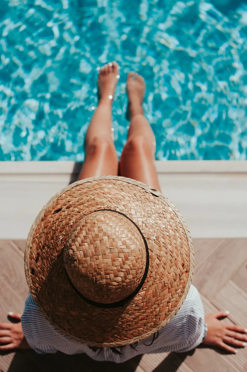 Person sitting at the edge of a pool with their feet in the water, evoking the deeper, drowsy calm of anti-anxiety medication