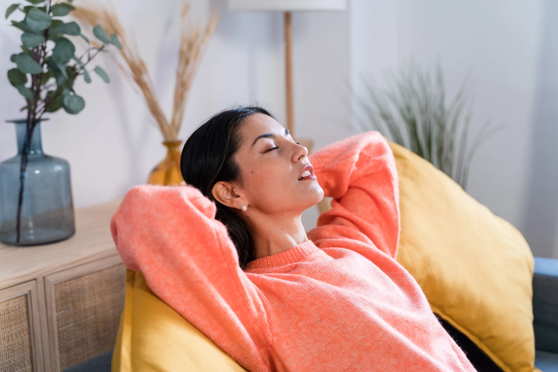 A woman resting peacefully with her eyes closed, feeling calm and at ease