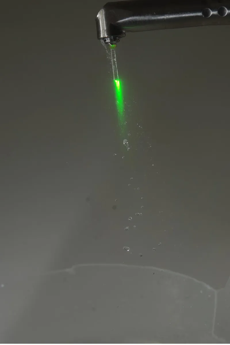 Fotona Er:YAG dental laser pulse contacting water — illustrating photoablation